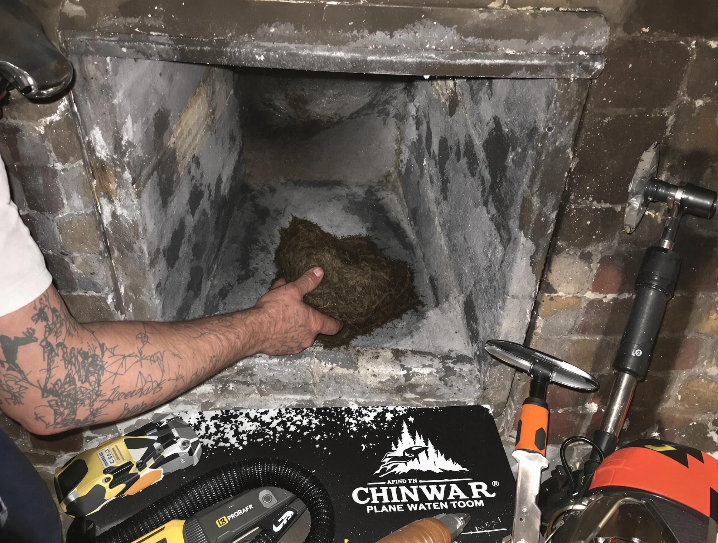 Orangetown Chimney Sweep safely removing debris and screening chimney in Orangetown, NY